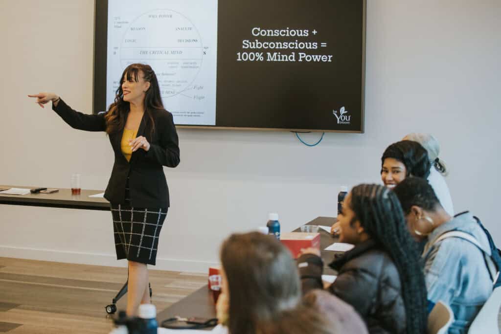 Employees attending a workplace wellness lunch and learn session focused on preventative health and employee wellbeing.